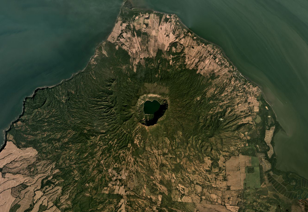 The Cosigüina caldera, 2.5 km wide and more than 500 m deep, is in the center of this December 2019 Planet Labs satellite image monthly mosaic (N is at the top; this image is approximately 25 km across). The ridge SE of the caldera is the Loma San Juan lava flows, and the El Barranco Maar is NNE of the caldera. The arcuate ridge to the W is the Filete Cresta Montosa, interpreted as the remains of an older caldera. Satellite image courtesy of Planet Labs Inc., 2019 (https://www.planet.com/).