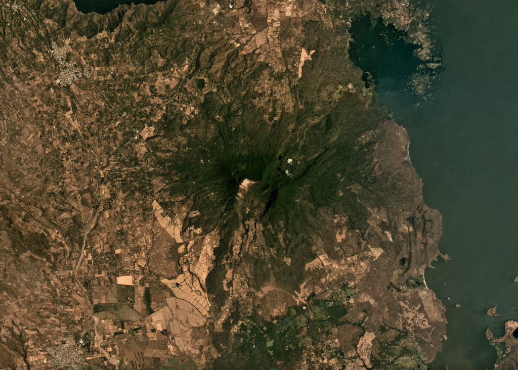 Two major flank-collapse scarps on the NE and SW sides of Mombacho are visible in this March 2019 Planet Labs satellite image monthly mosaic (N is at the top; this image is approximately 25 km across). The islands to the NE are part of the 56.8 km2 Las Isletas debris avalanche deposit; the 49.5 km2 El Crater debris avalanche deposit is to the S. The La Danta debris avalanche deposit is between the two on the SE flank and surrounding area. Satellite image courtesy of Planet Labs Inc., 2019 (https://www.planet.com/).