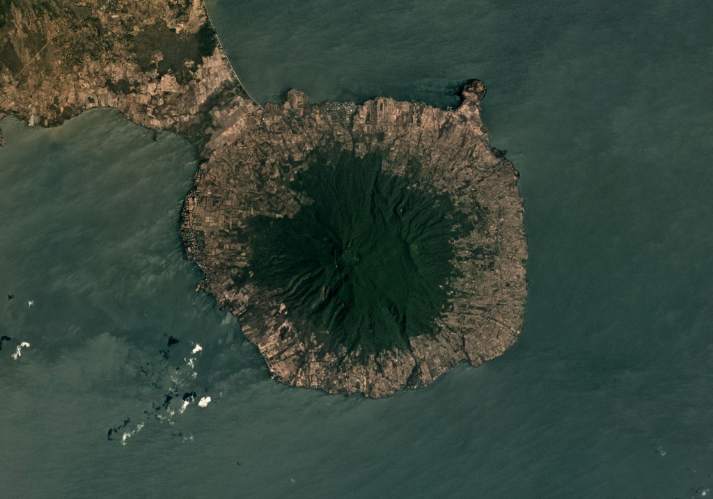 Maderas volcano forms the 12-km-wide SE part of Ometepe island, with Concepción out of view to the NE of this March 2019 Planet Labs satellite image monthly mosaic (N is at the top). The ridge on the SW flank is due to slumping and the ridge across the NE flank is due to normal faulting, creating a graben across the top of the edifice. A summit crater has formed within the graben. Satellite image courtesy of Planet Labs Inc., 2019 (https://www.planet.com/).