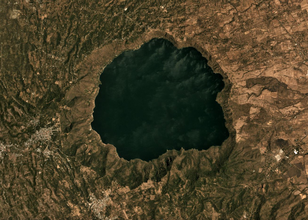 The 6.5-km-diameter Apoyo caldera formed during two Plinian eruptions around 24,000 years ago, seen in this March 2019 Planet Labs satellite image monthly mosaic (N is at the top; this image is approximately 13 km across). The caldera was created within broad lavas that formed the previous edifice. Satellite image courtesy of Planet Labs Inc., 2019 (https://www.planet.com/).