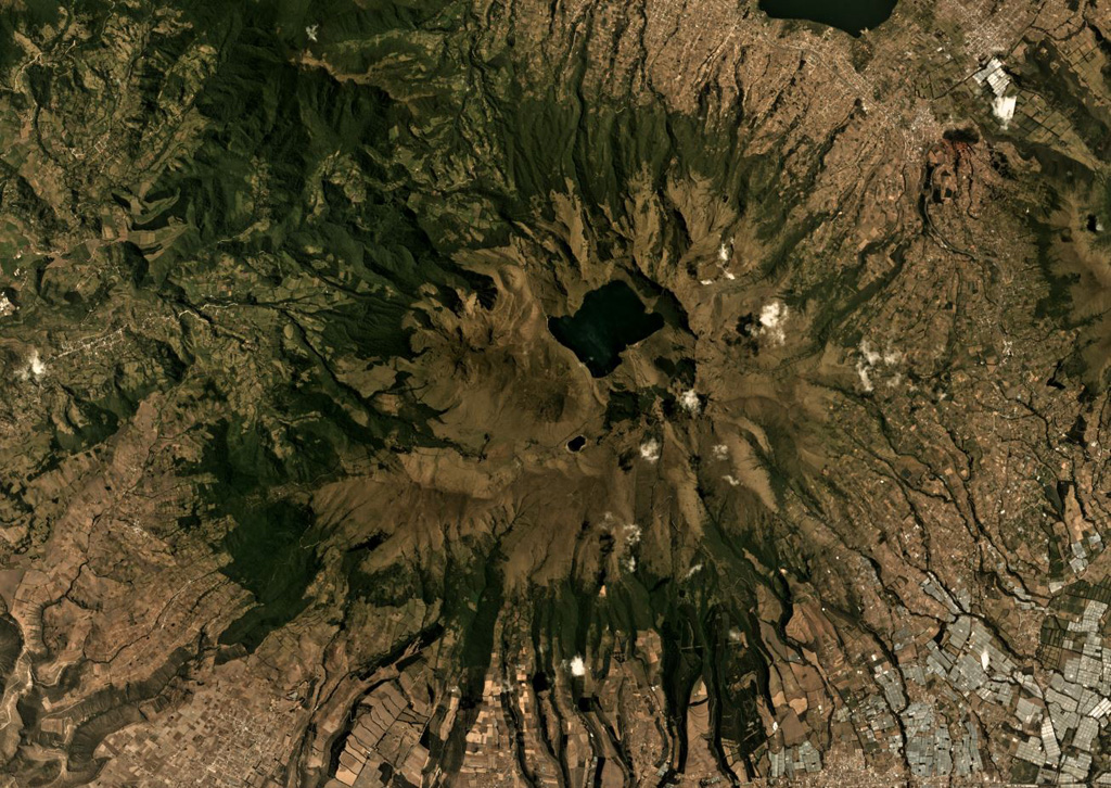 Mojanda volcano has a 3-km-wide caldera that contains the Laguna Grande de Mojanda, shown in this August 2019 Planet Labs satellite image monthly mosaic (N is at the top; this image is approximately 24 km across). The complex contains the older Fuya Fuya to the W, and Mojanda to the E. Fuya Fuya underwent a large flank collapse that produced the horseshoe-shaped scarp on the SW side, opening towards the W. The Cerro el Panecillo dome is on the NW flank. Satellite image courtesy of Planet Labs Inc., 2019 (https://www.planet.com/).