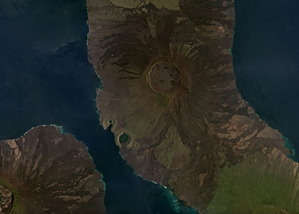 The 5-km-diameter, 200-m-deep summit caldera of the Volcán Darwin is near the center of this March 2019 Planet Labs satellite image monthly mosaic (N is at the top). Lava flows on all flanks have erupted from circumferential and radial fissures around the flanks and into the caldera. The Beagle and Tagus tuff cones are along the SW coastline, with the northern Tagus Cone containing Tagus Cove. Fernandina is SW and the northern flanks of Alcedo are S; Volcán Darwin is out of view to the N. Satellite image courtesy of Planet Labs Inc., 2019 (https://www.planet.com/).