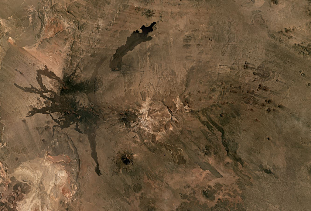The Cerro Payún Matru volcanic field in Argentina covers 5,200 km2 and contains a roughly 9-10 km diameter caldera in the center of this Planet Labs satellite image monthly mosaic (N is at the top; this image is approximately 81 km across). The caldera is associated with an ignimbrite deposit spanning 2,200 km2, and since its formation 168,000 years ago over 300 vents erupted. There are several larger cones with Cerro Payún reaching the highest elevation SSW of the caldera. The Pampas Negras lavas are to the W, and the Santa Maria lava flow is N of the caldera. Satellite image courtesy of Planet Labs Inc., 2019 (https://www.planet.com/).