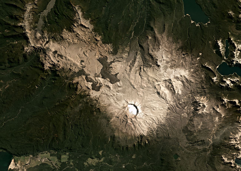 The Puyehue-Cordón Caulle volcanic complex spans 120 km2 across this March 2021 Planet Labs satellite image monthly mosaic (N is at the top) with the 2.4-km-wide Puyehue caldera to the E, the Cordillera Nevada caldera near the center, and the Cordón Caulle fissure system to the W. The darker 2011-2012 Cordón Caulle obsidian lava flows extend up to around 3 km from the vents. Older fissure ridges are visible in the western segment. Satellite image courtesy of Planet Labs Inc., 2019 (https://www.planet.com/).