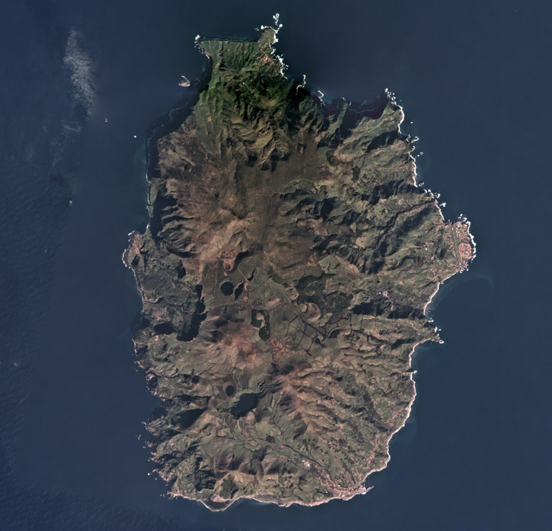In the Azores archipelago west of the Mid-Atlantic Ridge is the 12 x 17 km Flores Island, shown in this February 2018 Planet Labs satellite image monthly mosaic (N is at the top). Initially a submarine volcano, the island formed through the eruption of different vents, forming cones, craters, maars, and associated eruption products like lava flows. Satellite image courtesy of Planet Labs Inc., 2019 (https://www.planet.com/).