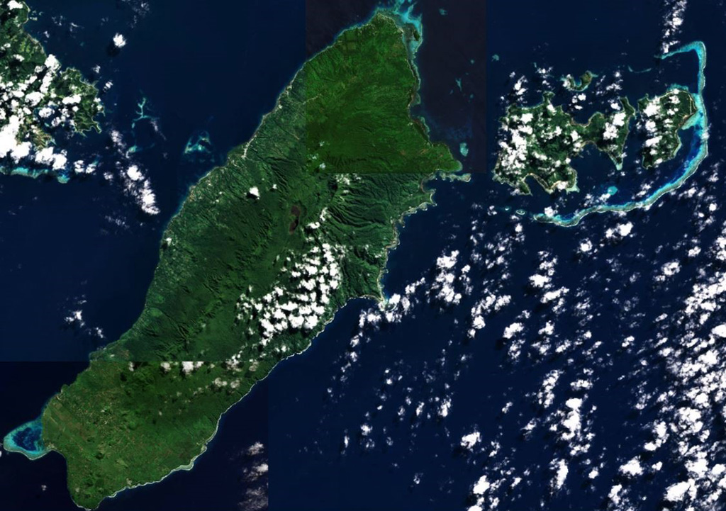 Taveuni Island in Fiji is situated along a larger ridge and is approximately 40 km long, shown in this composite image of Sentinel-2 (3 and 6 July) and Landsat 8 (1 July) 2019 images courtesy of Planet Labs (N is at the top). Around 150 vents are aligned along the length of the  NW-SE oriented island. The Lake Tagimoucea Basin rift zone is about one-third of the way down and contains lavas offset by faulting. Satellite image courtesy of Planet Labs Inc., 2019 (https://www.planet.com/).