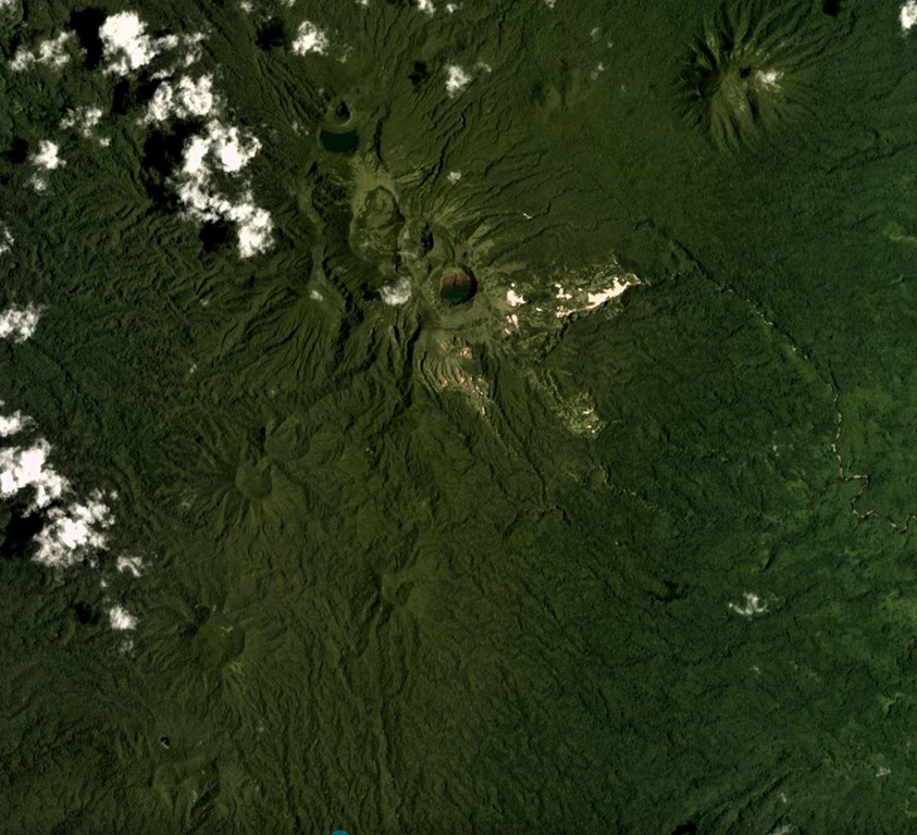 Craters and cones of Suretamatai in Vanua Lava Island, Vanuatu, are visible across this February 2018 Planet Labs satellite image monthly mosaic (N is at the top; this image is approximately 10 km across). The field covers much of the island, with a NNE-SSW trend of cones (shown here), with the largest edifice towards the northern end having formed multiple craters along a NW-SE trend. Geothermal activity continues. Satellite image courtesy of Planet Labs Inc., 2019 (https://www.planet.com/).