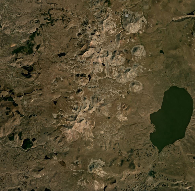 The central part of the 40-km-long (N-S) Samsari Volcanic Center is shown in this September 2019 Planet Labs satellite image monthly mosaic (N is at the top; this image is approximately 30 km across). At least 20 edifices form the complex, and the Samsari edifice and caldera is in the center of the top third of this image. The southernmost cone in this image is Patara Abuli and the closest NW cone is Didi Abuli. Satellite image courtesy of Planet Labs Inc., 2019 (https://www.planet.com/).