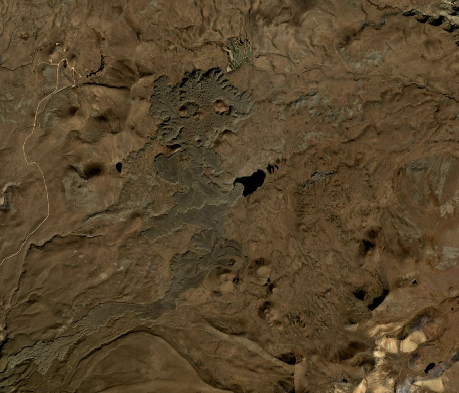 A group of scoria cones with recent lava flows of the Tskhouk-Karckar volcanic group are in the center of this October 2019 Planet Labs satellite image monthly mosaic (N is at the top; this image is approximately 16 km across). The longest flow to the south traveled around 9 km from the vent. The lavas have abundant lobate flow edges and pressure ridges, and overlap older cones and flows. Satellite image courtesy of Planet Labs Inc., 2018 (https://www.planet.com/).