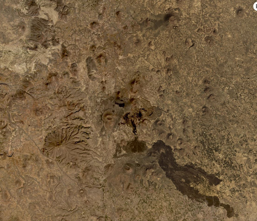 The 1,500 km2 Harra of Arhab volcanic field is shown down the center of this December 2019 Planet Labs satellite image monthly mosaic (N is at the top; this image is approximately 76 km across). Approximately 60 cones are throughout the field; recent, darker lava flows are visible near the center of this image. Satellite image courtesy of Planet Labs Inc., 2019 (https://www.planet.com/).