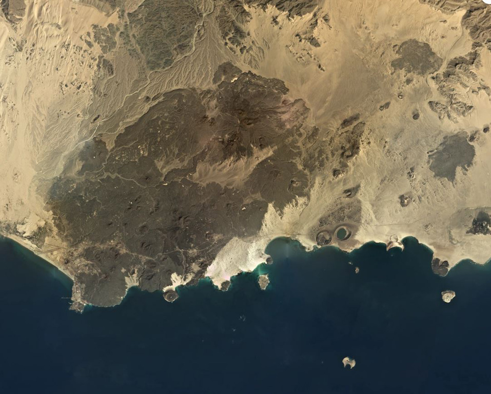 The Bir Borhut volcanic field in southern Yemen is shown in this December 2019 Planet Labs satellite image monthly mosaic (N is at the top; this image is approximately 104 km across). The field contains scoria cones, tuff rings and cones, mars, and lava flows. The At-Tabâb maar is SE of the lava field along the coastline. Satellite image courtesy of Planet Labs Inc., 2019 (https://www.planet.com/).