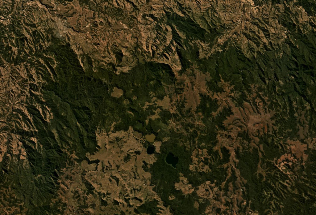 The Ankaizina volcanic field in Northern Madagascar is in the area shown in this Planet Labs satellite image monthly mosaic (N is at the top; this image is approximately 25 km across). The largely vegetated field contains scoria cones and lava flows. Satellite image courtesy of Planet Labs Inc., 2019 (https://www.planet.com/).