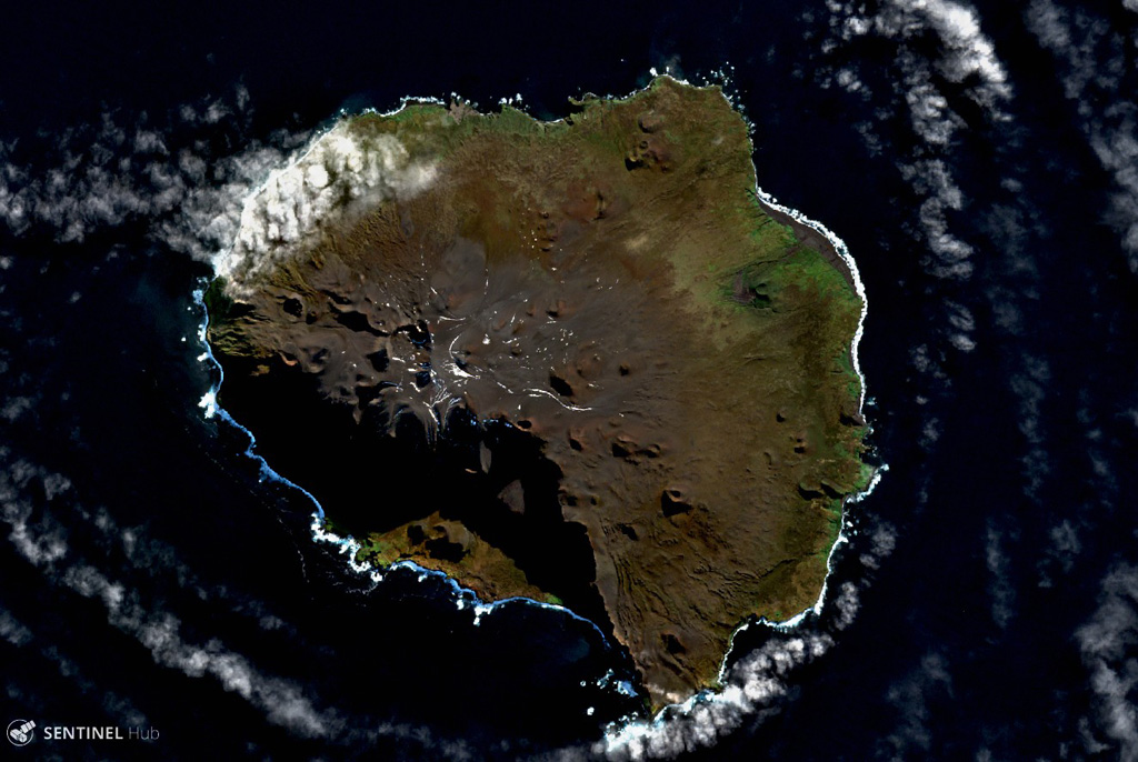 This shadows captured in this Sentinel-2 satellite image acquired on 19 May 2019 (N is at the top) highlights the steep southern cliffs of Ile aux Cochons. The 10-km-wide island has preserved scoria cones with craters across the landmass. Satellite image courtesy of Copernicus Sentinel Data, 2019.