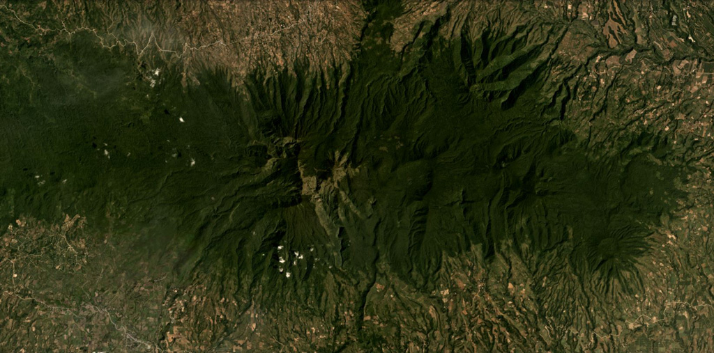 Kalatungan forms the E-W trending volcanic ridge across this November 2019 Planet Labs satellite image monthly mosaic (N is at the top; this image is approximately 25 km across). Extensive erosion has formed ridge-and-gully topography across the flanks. Satellite image courtesy of Planet Labs Inc., 2020 (https://www.planet.com/).
