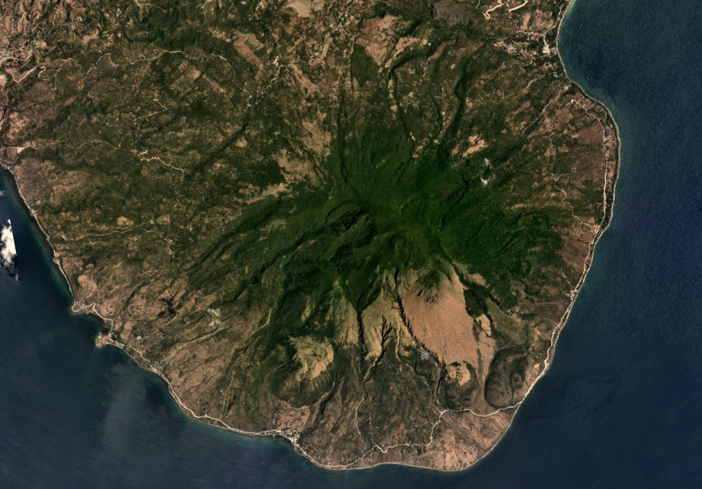 Malindig (or Marlanga) volcano is located in southern Marinduque island, shown in this April 2019 Planet Labs satellite image monthly mosaic (N is at the top; this image is approximately 13 km across). The irregular summit shows evidence of lava dome emplacement, possible flank collapse or landslide scarps, and extensive erosion. Satellite image courtesy of Planet Labs Inc., 2019 (https://www.planet.com/).