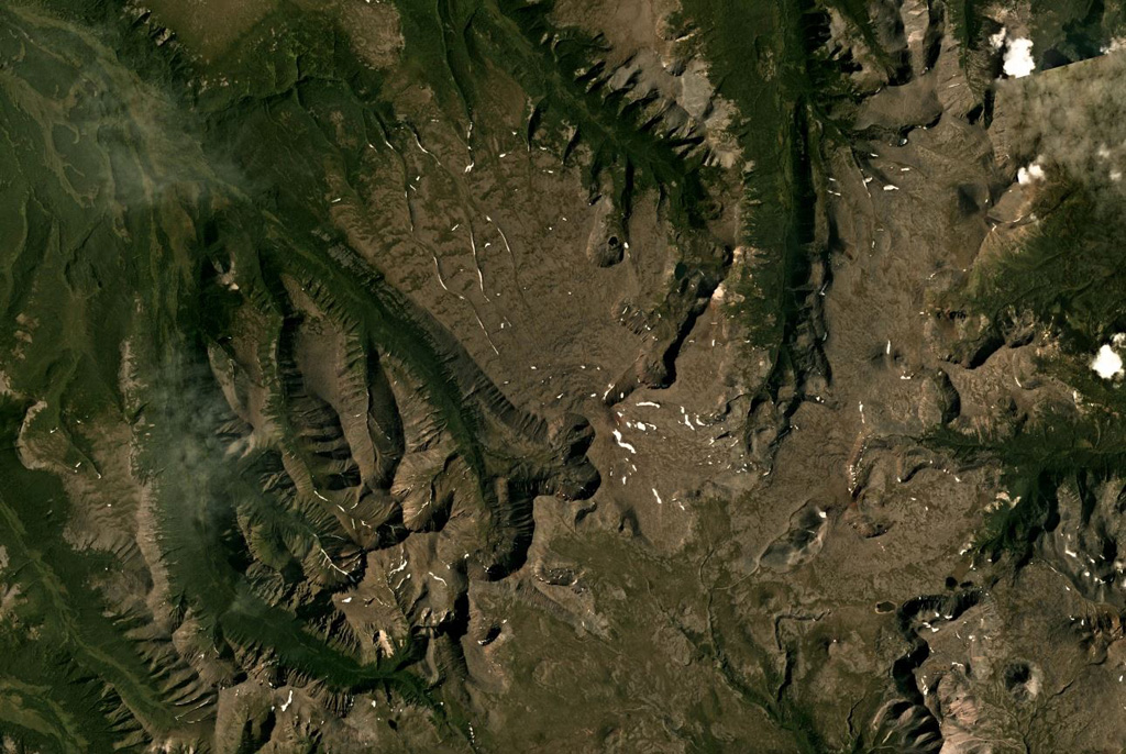 The summit of Bolshoi Payalpan is near the center of this August 2019 Planet Labs satellite image monthly mosaic (N is at the top; this image is approximately 31 km across). Erosion has produced deep valleys across the flanks. Maly Payalpan is in the SE corner of this image. Satellite image courtesy of Planet Labs Inc., 2019 (https://www.planet.com/).