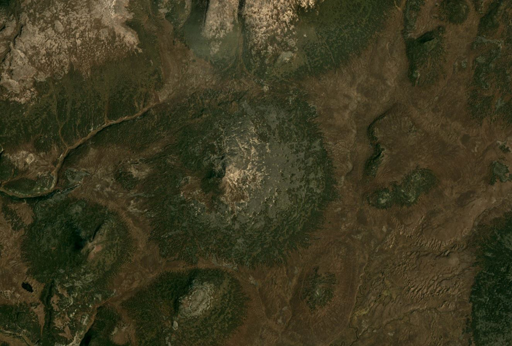 The small Geodesistoy cone has a basal diameter of around 6 km, shown in the center of this September 2019 Planet Labs satellite image monthly mosaic (N is at the top; this image is approximately 14 km across). Satellite image courtesy of Planet Labs Inc., 2019 (https://www.planet.com/).