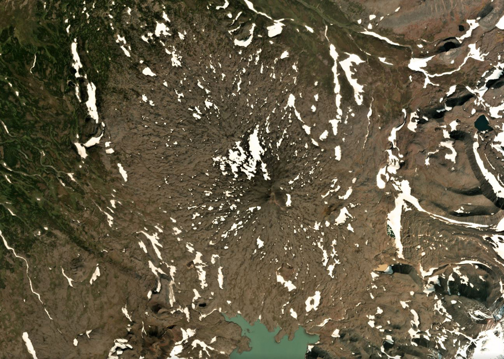 Mezhdusopochny volcano is north of Lake Mezhdusopochny, and is shown in the center of this September 2018 Planet Labs satellite image monthly mosaic (N is at the top; this image is approximately 14 km across). To the E are the western flanks of Shishel. Satellite image courtesy of Planet Labs Inc., 2018 (https://www.planet.com/).