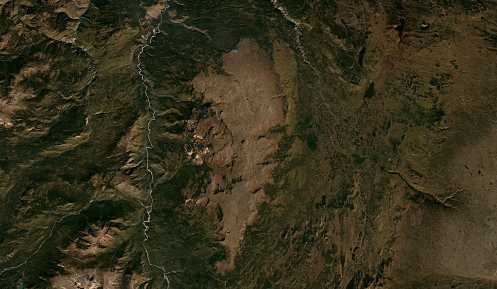 The Heart Peaks volcanic center in Canada is down the center of this September 2019 Planet Labs satellite image monthly mosaic (N is at the top; this image is approximately 58 km across). The volcano was constructed through lava flow emplacement, then lava dome growth to form the summit ridge. Satellite image courtesy of Planet Labs Inc., 2019 (https://www.planet.com/).
