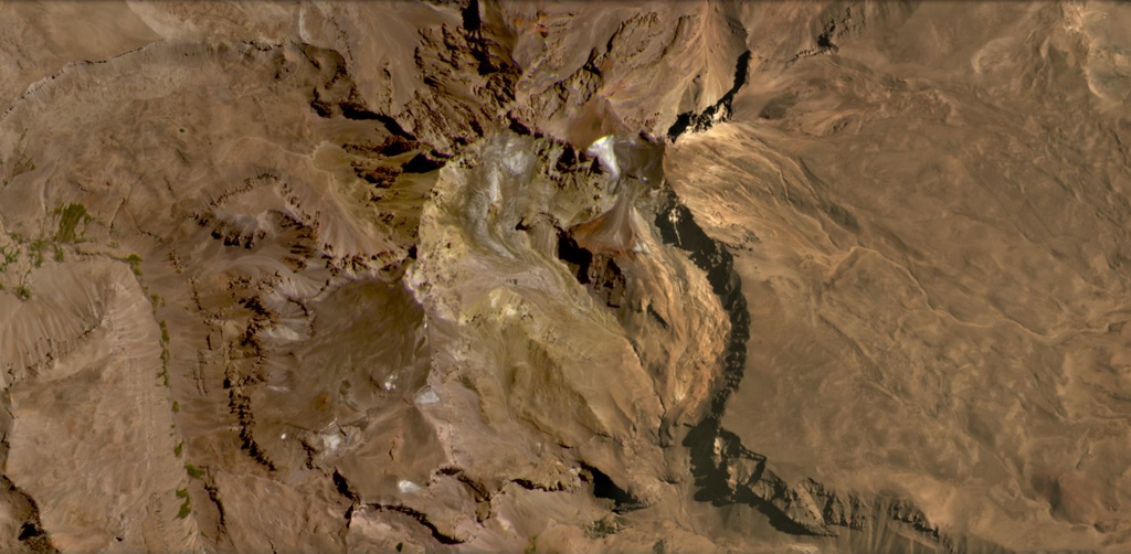 Risco Plateado covers an area of 910 km2 and has a steep mountainous relief partly due to glacial erosion, shown in this February 2021 Planet Labs satellite image monthly mosaic (N is at the top; this image is approximately 15 km across). there is a scoria cone on the SE flank, visible in the lower right corner of the image. Satellite image courtesy of Planet Labs Inc., 2021 (https://www.planet.com/).