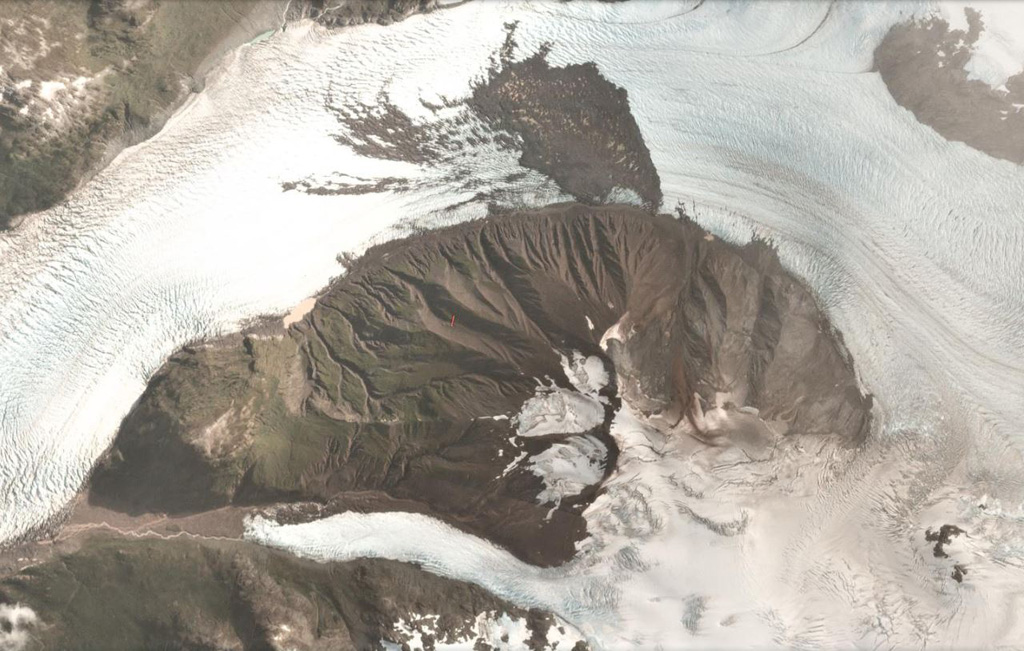 Amalia Glacier flows around the northern flank of Reclus in the Southern Patagonia Ice Field, shown in this 27 February 2018 PlanetScope satellite image (N is at the top; this image is approximately 8 km across). The flanks are heavily eroded and there is a landslide deposit from the northern flank on the glacier surface. Satellite image courtesy of Planet Labs Inc., 2018 (https://www.planet.com/).
