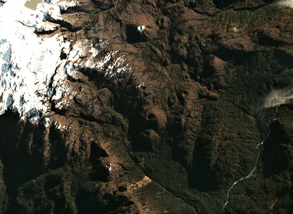 Scoria cones of the Meullín volcanic field are across this May 2018 Planet Labs satellite image monthly mosaic (N is at the top; this image is approximately 8.5 km across). The field is located in southern Chile and the small cones are vegetated, many with visible summit craters. Satellite image courtesy of Planet Labs Inc., 2018 (https://www.planet.com/).