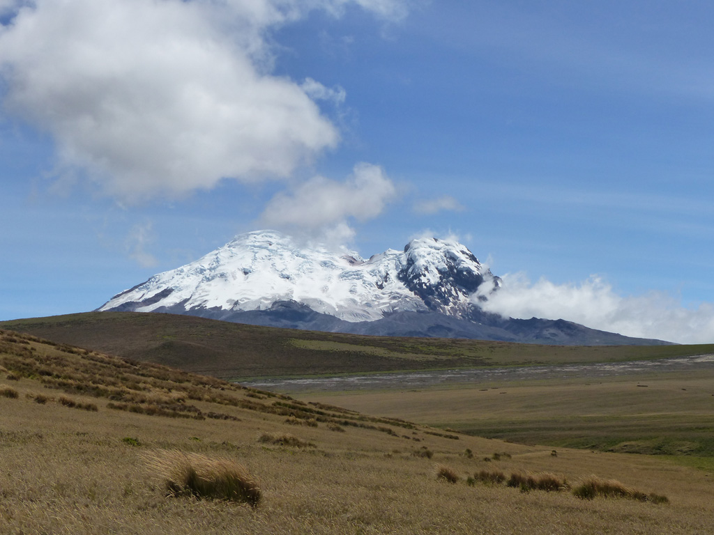 Volcán Antisana is seen here looking NE from highway E20 in December 2015. Northeast Peak is to the right and the East Ridge is to the left, with a collapse scarp between them. Photo by Ailsa Naismith, 2015.
