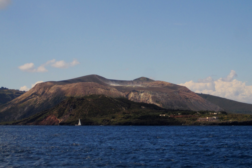 The Fossa cone, formed within the Fossa caldera around 6,000 years ago, is seen here in May 2011. Eruptions there have produced lava flows that reach the base of the cone, pyroclastic surge deposits from phreatomagmatic eruptions, ashfall units, and ballistic ejecta. Photo by Arianna Soldati, 2011.