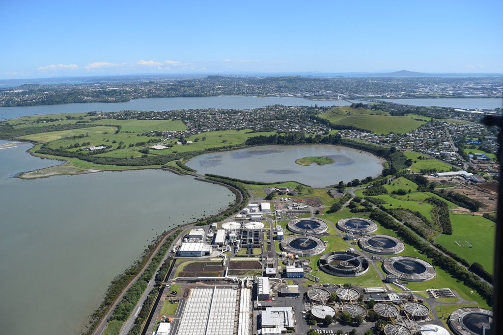 Mangere Lagoon is a tuff ring within the Auckland Volcanic Field, seen here from the south in 2018, with the Mangere Mountain scoria cone to the upper right. Rangitoto is in the distance. Photo by Bruce Hayward, 2018.