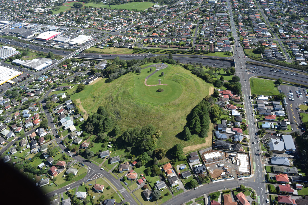 Mount Roskill or Pukewīwī / Puketāpapa is one of around 53 volcanic centers in the Auckland Volcanic field, seen here in 2018 from the south. The scoria cone was a source of lava flows around 100 ka. Photo by Bruce Hayward, 2018.