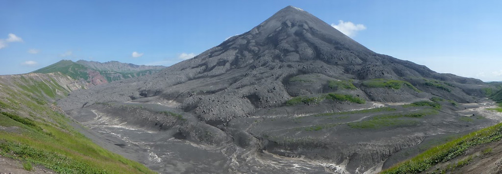 The flanks of Karymsky are composed of thick lava flows that have infilled the Karymsky caldera, seen here in 2014. The NW caldera rim is to the left. Photo by Janine Krippner, 2014.