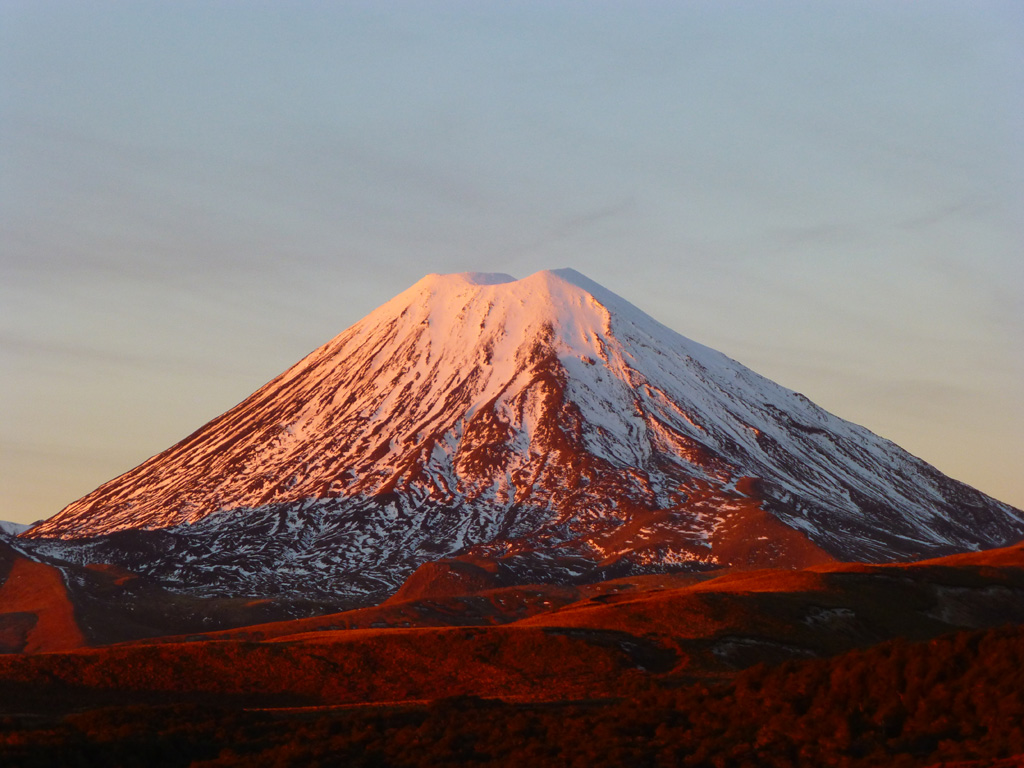 The Ngauruhoe cone reaches around 900 m above the Tongariro volcanic complex. Seen here from the W in 2012, the summit scoria cone mostly formed in 1954-55 within the larger summit crater area. The older crater rim is on the right side of the summit in this view. Photo by Janine Krippner, 2012.